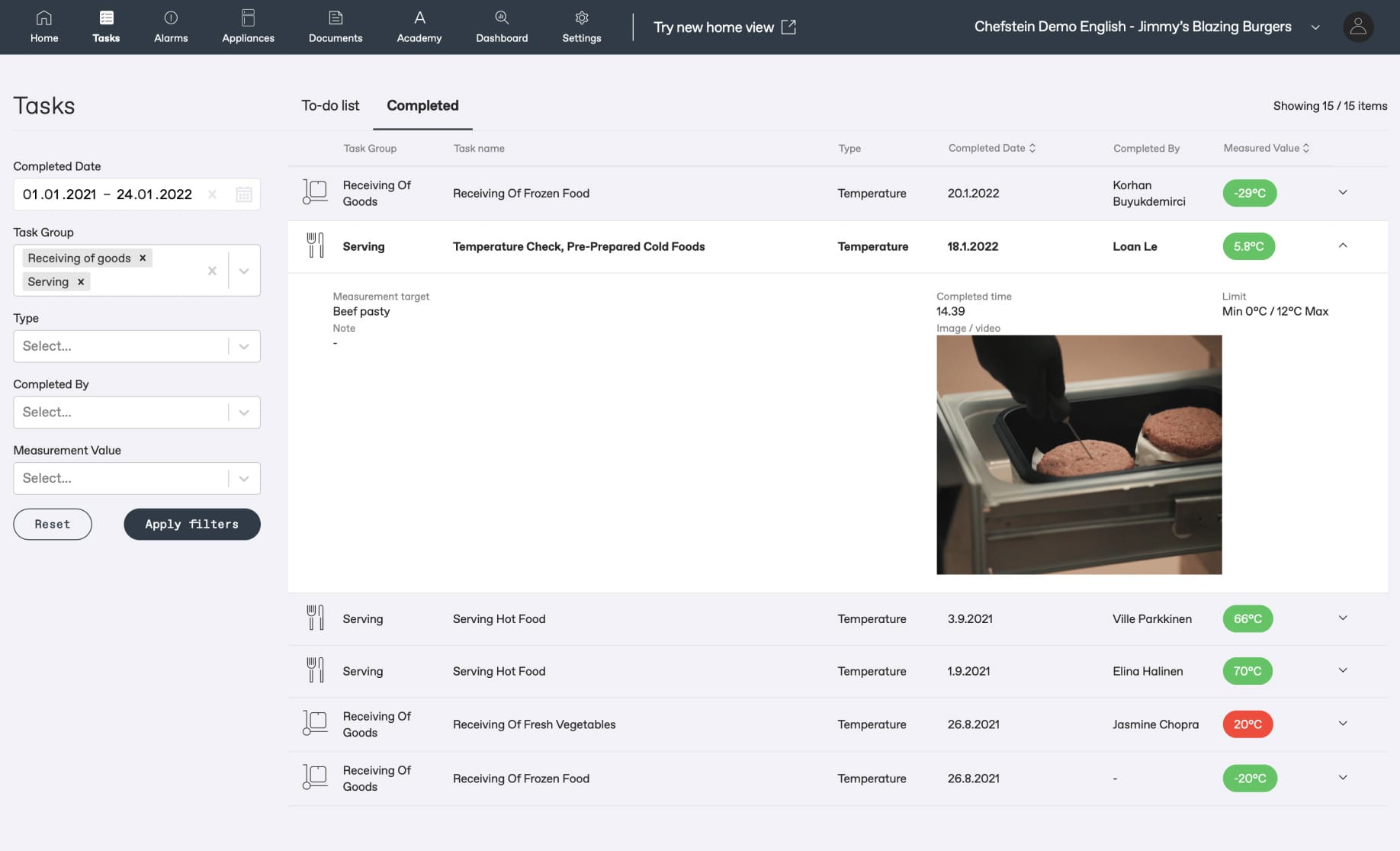 Restaurant task management interface showing completed temperature checks for food items with a photo of beef patties being measured.