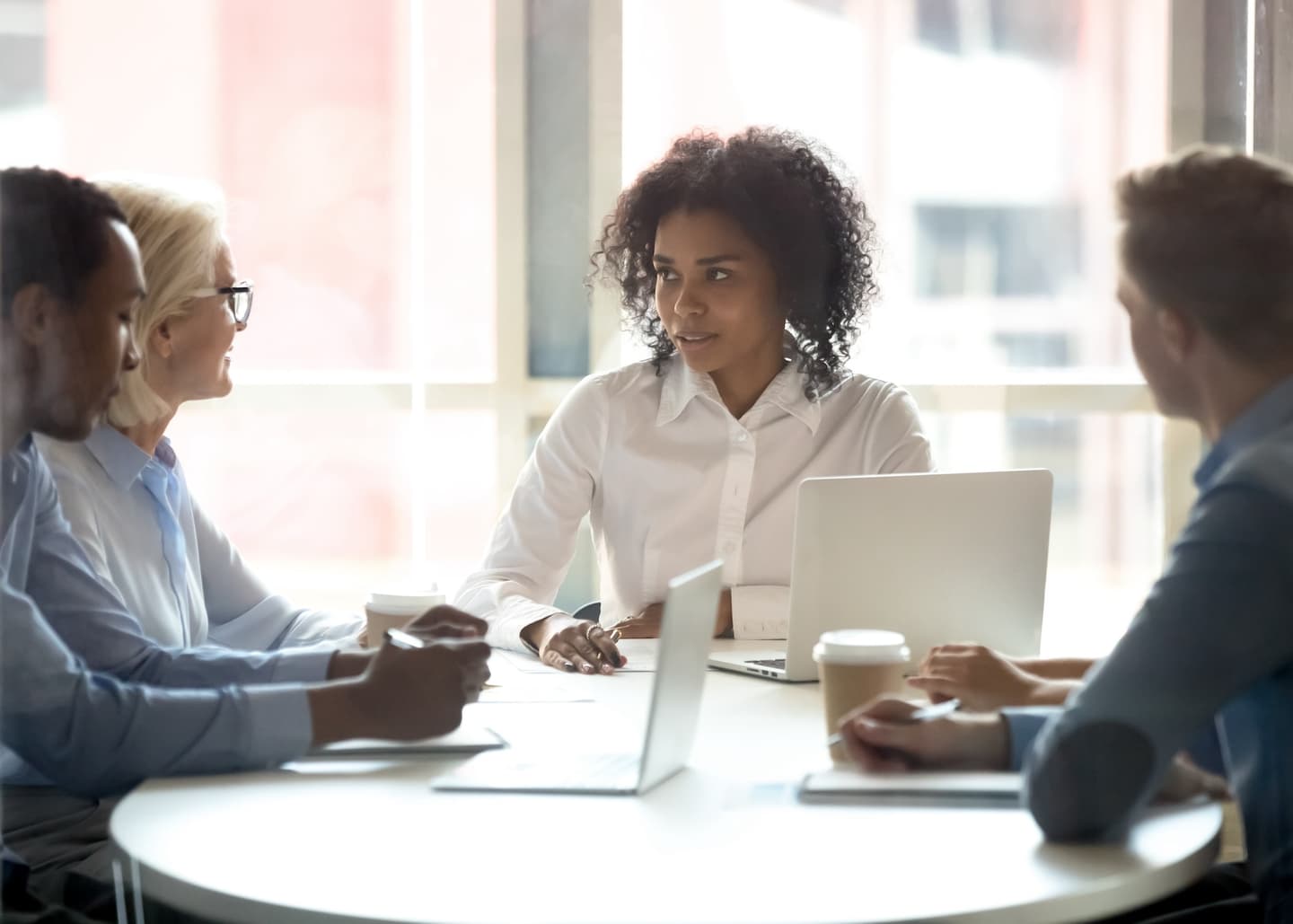 Group of people in a discussion in a conference room