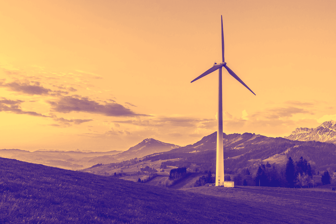 Image of a wind turbine on mountain range